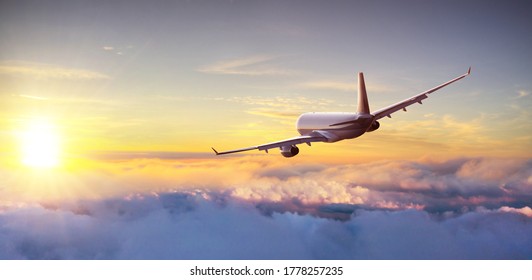 Commercial airplane flying above clouds, backside view. Beautiful sunset light. - Shutterstock ID 1778257235