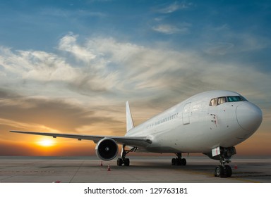 Commercial airplane and sunset