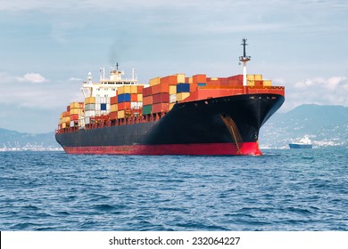 commercial cargo ship full of containers