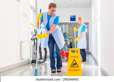 Commercial Cleaning Brigade Working Mopping The Floor