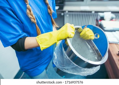 Commercial Cleaning Lady Emptying Rubbish Bin Of An Office