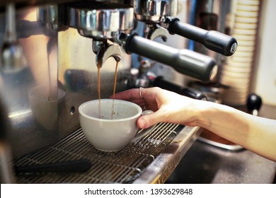 Commercial Coffee Machine Making Coffee By Barista