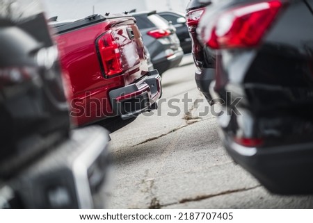Commercial Dealership of Pre Owned Cars. Parking Lot Full of All Kind of Different Motor Vehicles. Automotive and Transportation Industry Theme.