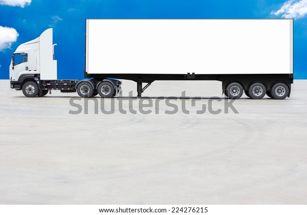 commercial delivery cargo container\
truck with white trailer blank for design against blue\
sky