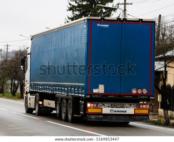 Commercial delivery truck on asphalt road in\
Targoviste, Romania,\
2019.
