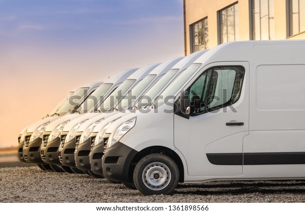 commercial delivery vans parked in row.\
Transporting service\
company.