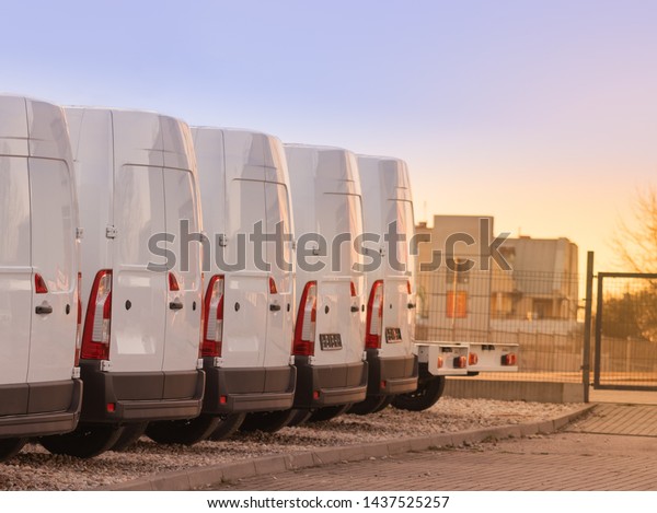 commercial delivery vans parked in row.\
Transporting service\
company.