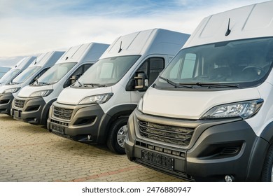 Commercial delivery vans parking in a row, transporting and shipping service company