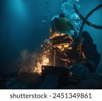 Commercial diver welding and cutting underwater closeup