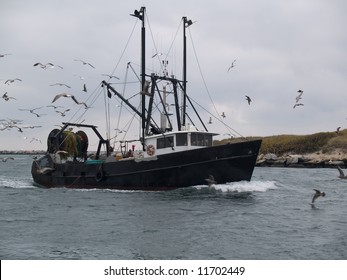 Commercial Fishing Boat Returning To Harbor