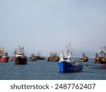  Commercial fishing boats, vessels,  fishing trawler at sea.fishing in Asia, fishing industry, shipping.difficult navigation, problematic divergence of ships