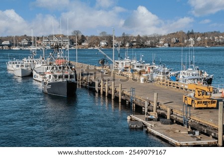Commercial Fishing Pier:  Fishing boats dock at a working pier in Portsmouth, New Hampshire.
