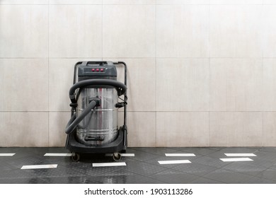 Commercial Hoover Next To The Wall At Car Wash. Copy Space For Text. Commercial Vacuum Cleaner, Self Service.