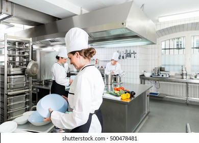 Commercial Kitchen With Chefs Cooking