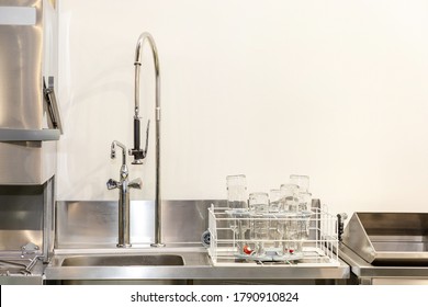 Commercial Kitchen Sink With Sprayer Faucet In Restaurant