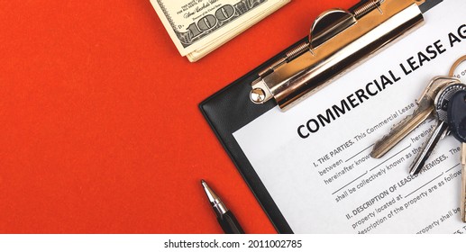 Commercial Lease Agreement. Clipboard With Business Document, Pen And Money. Red Background, Copy Space 