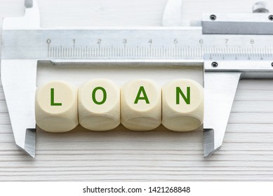 Commercial Loan Sizing And Measurement Concept : Word Loan Measured By A Vernier Caliper, Depicts Loan To Value Ratio Where The Size Is How Much Loan The Lender Able To Give Borrower Related To Value