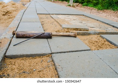 Commercial Paving In Progress Laying New Pavement At The Side Of The Road.