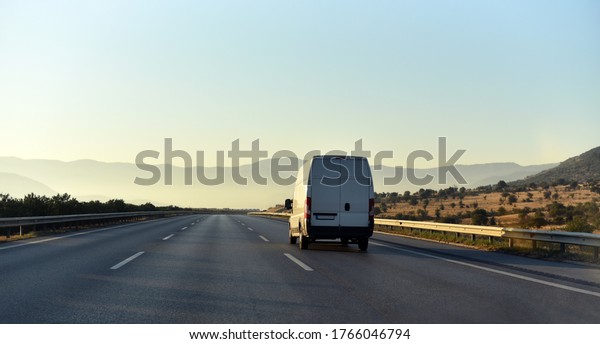 commercial van is\
delivering cargo to\
countryside