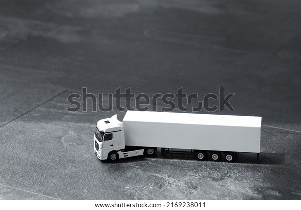Commercial van truck on dark background.\
Transport and\
shipping