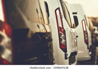 Commercial VANs Parked In Row On Dealership Parking