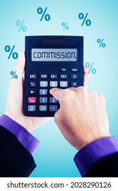 Commission concept. Businessman hands using a calculator with commission word and percentage symbol
