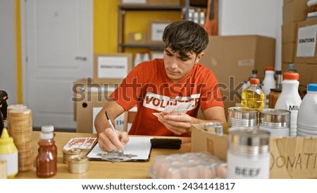 Committed young hispanic teen volunteer diligently counting iceland krona banknotes for charity, writing tallies on clipboard at center