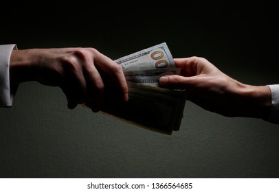 Committing A Crime. Closeup Image Of Businessman Taking Stack Of Money As Bribe. Executive Taking Money, Bribery And Illegal Business Among Senior Officials. Corrupt Practices. Corruption. Bribe.