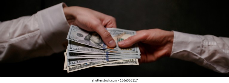 Committing A Crime. Closeup Image Of Businessman Taking Stack Of Money As Bribe. Executive Taking Money, Bribery And Illegal Business Among Senior Officials. Corrupt Practices. Corruption. Bribe.