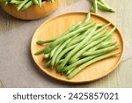 Common bean,Bush beans are french green beans in wooden plate.