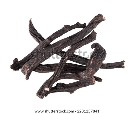 Common comfrey root isolated on white background. Dry roots of Symphytum officinale. Top view.