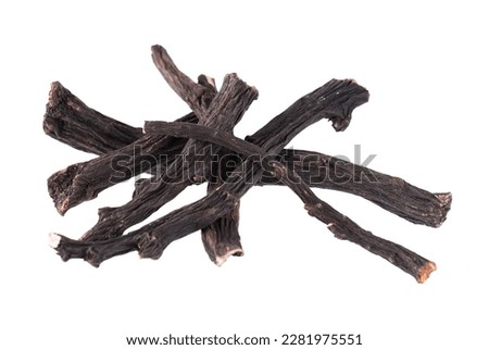 Common comfrey root isolated on white background. Dry roots of Symphytum officinale.