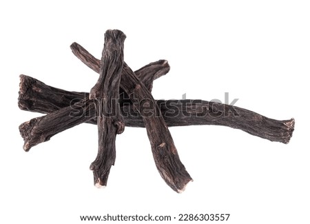 Common comfrey root isolated on white background. Dry roots of Symphytum officinale