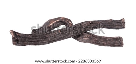 Common comfrey root isolated on white background. Dry roots of Symphytum officinale