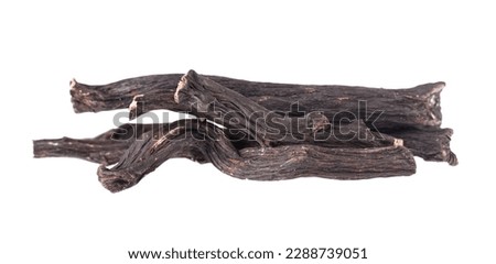 Common comfrey root isolated on white background. Dry roots of Symphytum officinale