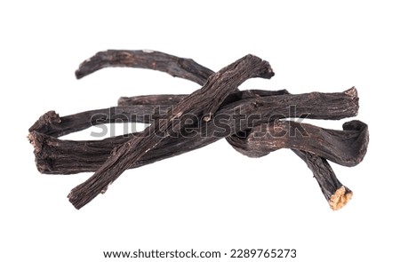 Common comfrey root isolated on white background. Dry roots of Symphytum officinale