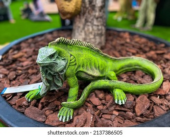 Common Green Iguana Resting On Tree Trunks (like Real) 