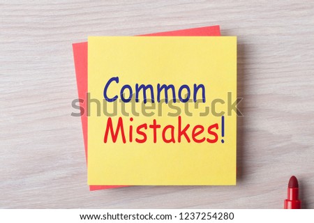 Common Mistakes written on note with marker pen. Business concept.