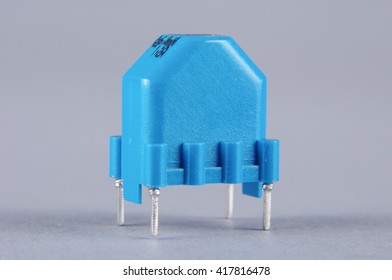 Common mode choke electronic component isolated on the gray background