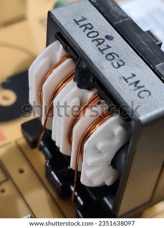 Common mode choke electronic component close up.