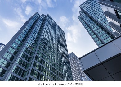 Common modern business skyscrapers, high-rise buildings, architecture raising to the sky, sun. Concepts of financial, economics, future etc.
