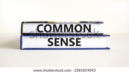 Common sense symbol. Concept words Common sense on beautiful books. Beautiful white table white background. Business, motivational common sense concept. Copy space.