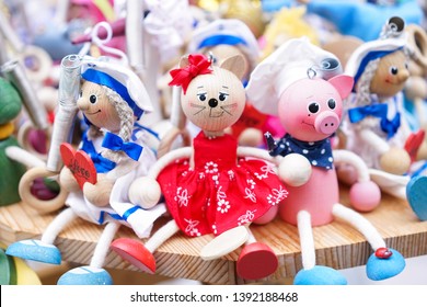 Common souvenirs of animal toys. Wooden animal toys of a chef pig, a cat and a sailor girl. These toys are general souvenirs from the Postojna cave.