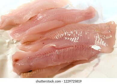 Common Whitefish Fillets On White Wrapping Paper