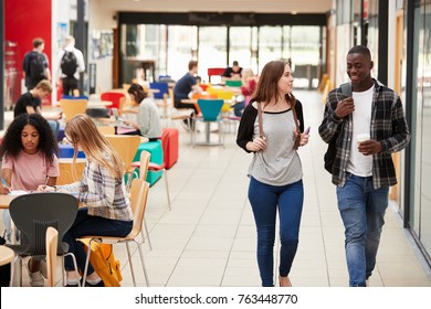 Communal Area Of Busy College Campus With Students