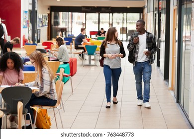 Communal Area Of Busy College Campus With Students