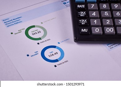 Communal Payments. Pie Charts Gas And Electric Supply Record In The Utility Bill Next To Calculator. Close-up