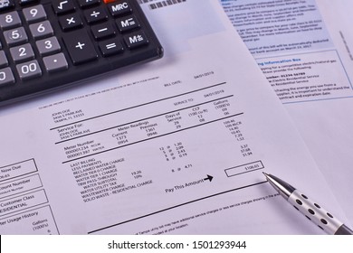 Communal Payments. Utility Bill With Calculator And Pen. Close-up