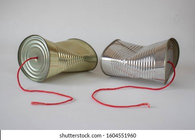 Communication breakdown concept using a tin can telephone 