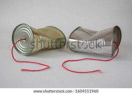 Communication breakdown concept using a tin can telephone 